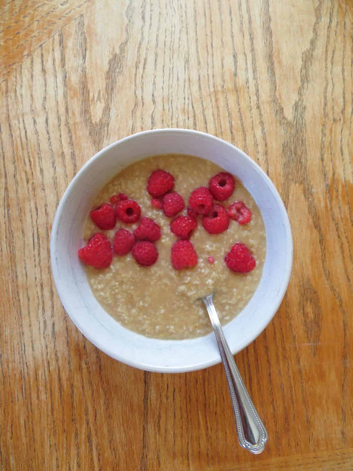 Nourishing oatmeal bowl with fresh raspberries.  - The Midwest Kitchen Blog
