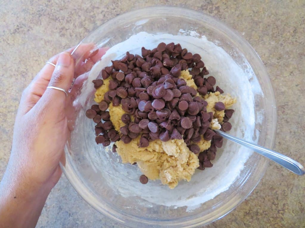 cookie dough with a pile of chocolate chips.