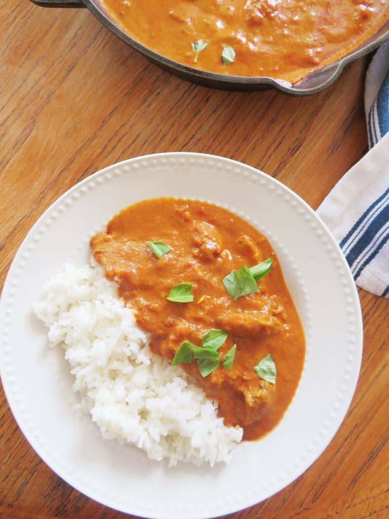 Chicken tikka masala with white rice and basil leaves. - The Midwest Kitchen Blog