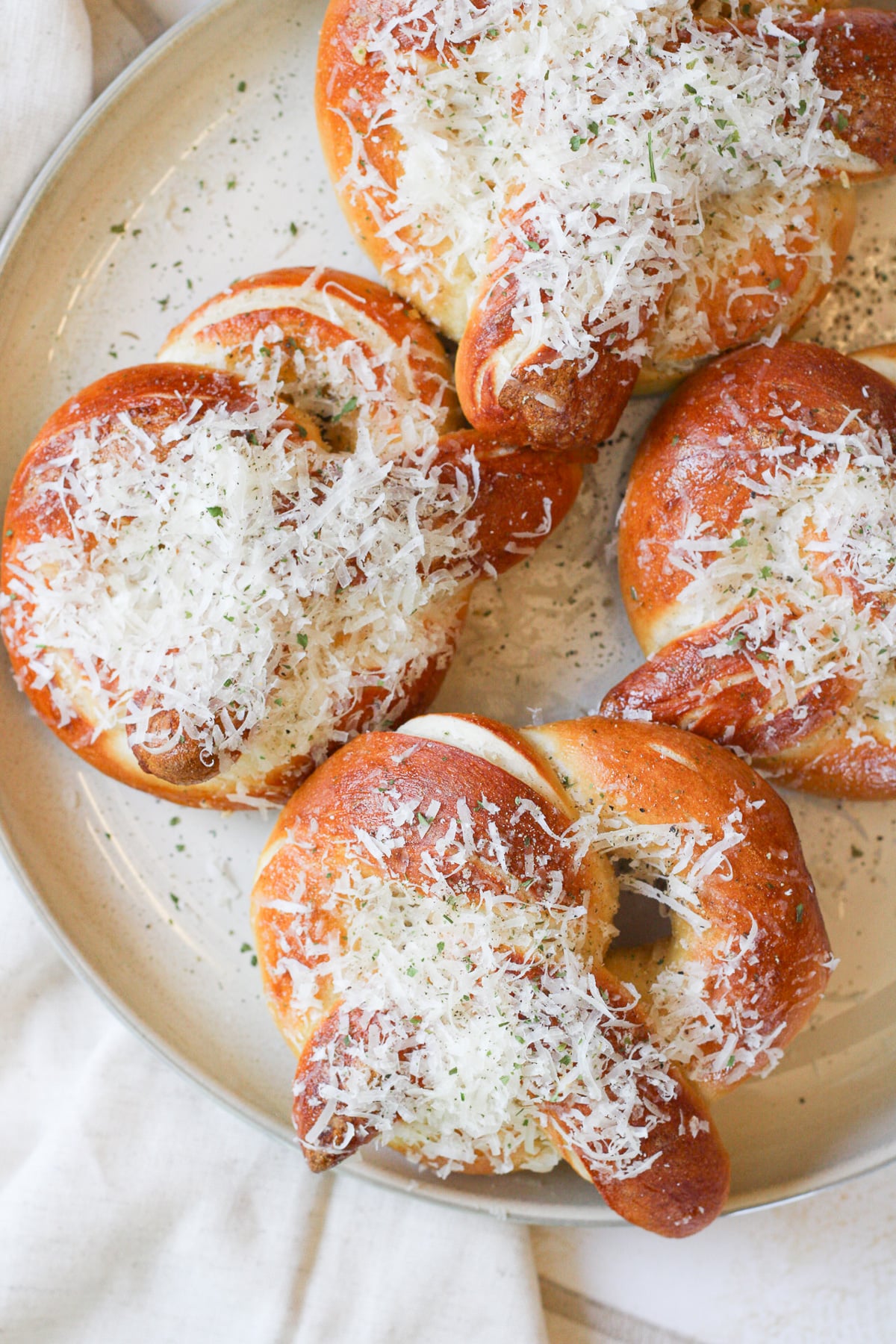 Garlic parmesan soft pretzels on a plate.
