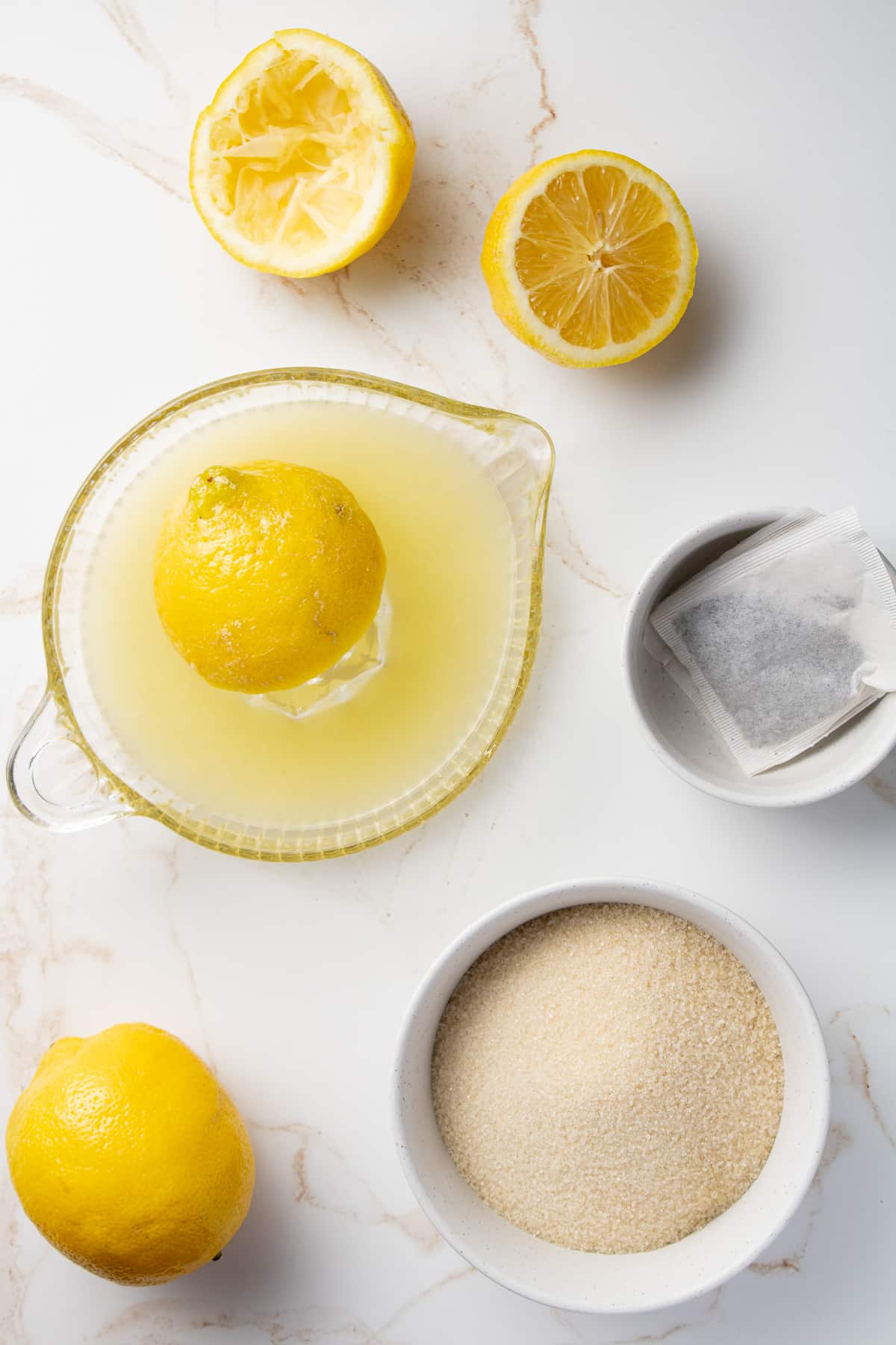 Iced tea tea lemonade ingredients on a counter.