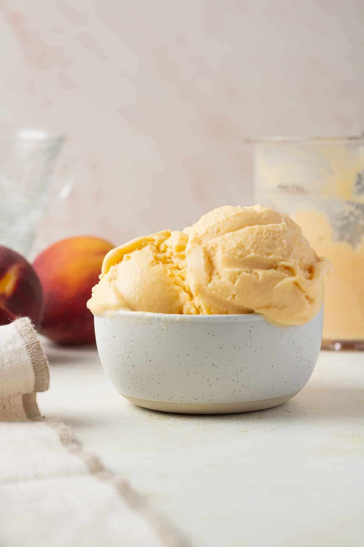 Close up image of ninja creami peach ice cream in a bowl.